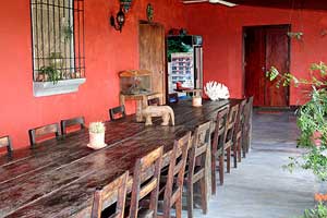 The colorful dining room is on a covered patio.